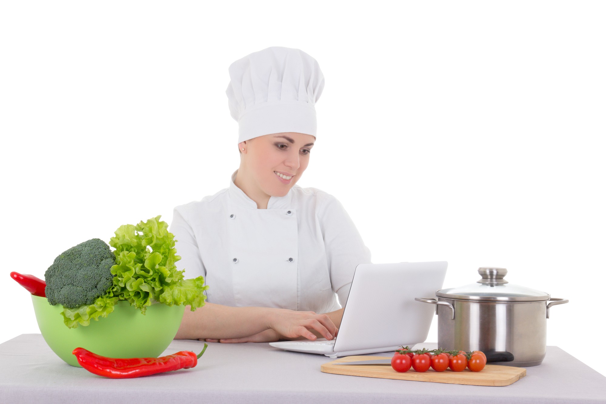 Chef teaching an online class with laptop and plated food